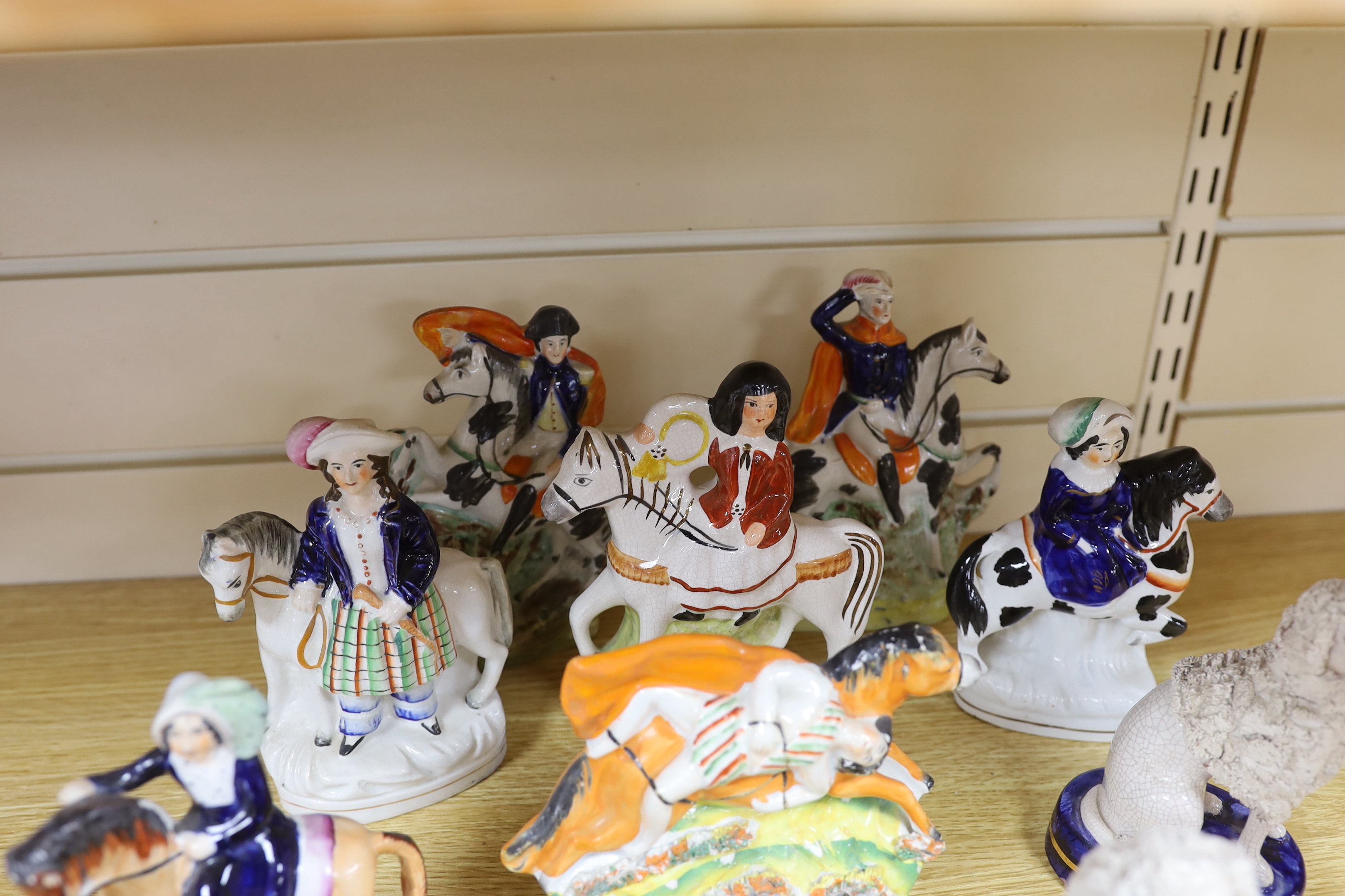 Nine Victorian Staffordshire figures or groups, three reproductions and a pair of Continental porcelain figures of dogs, tallest 17.5cm